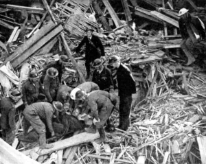 Debris Prints: Rescue workers releasing a man from a bomb damaged building, World War II, 1940
