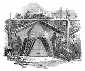 Heating Prints: One of the Retorts for Burning the Turf into Charcoal, 1850. Creator: Smyth