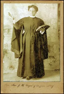 Rev. Mrs. J. H. Vigal of Buffalo, N.Y. arm raised, holding Bible, c1880-c1889. Creator: Unknown