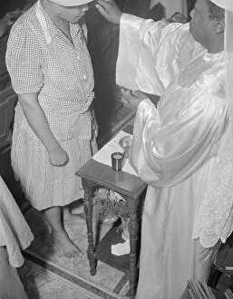 Safety Film Negatives Gmgpc Collection: Reverend Clara Smith anointing a member of the St. Martins Spiritual... Washington, D.C. 1942