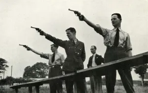 Stewart Oliver Prints: Revolver practice at the Elementary Flying Training School, 1941. Creator: Charles Brown