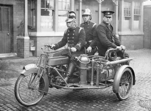 Fire Hose Prints: A Rex motorcycle being used by firemen