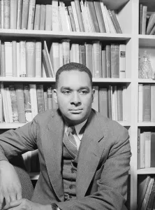 Bookshelves Prints: Richard Wright, Negro poet, in his study, New York, 1943. Creator: Gordon Parks