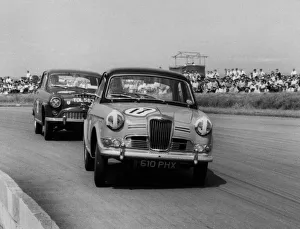 Saloon Prints: Riley 1. 5, Grace leads Jack Sears in Austin Westminster at Silverstone 1958