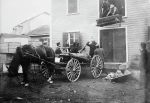 Pulley Prints: Rimouski - handling coffins of victims, 1914. Creator: Bain News Service