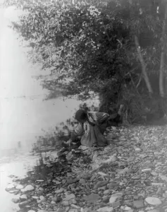 Flathead Prints: By the river-Flathead, c1910. Creator: Edward Sheriff Curtis