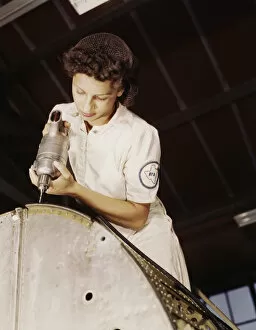 Women At War Gallery: A rivet is her fighting weapon... Naval Air Base, Corpus Christi, Texas, 1942