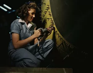 Mechanic Gallery: Riveter at work on Consolidated bomber, Consolidated Aircraft Corp. Fort Worth, Texas, 1942