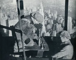 Rivetting the last bolts on The Morning Mast of the Empire State building, c1931. Artist: Lewis Wickes Hine