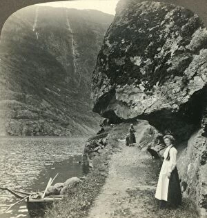 Underwood Travel Library Gallery: Where the road creeps under the jutting cliffs by the waters of the Nerofjord, Norway, c1905