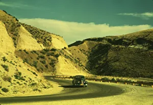Road cut into the barren hills which lead into Emmett, Idaho, 1941. Creator: Russell Lee