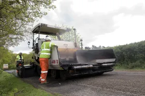Repairs Prints: Road resurfacing work repairing potholes