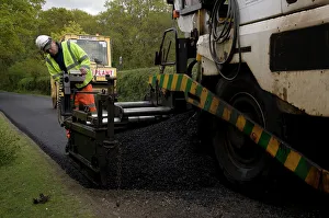 Repairs Prints: Road resurfacing work repairing potholes