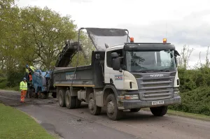 Repairs Prints: Road resurfacing work repairing potholes