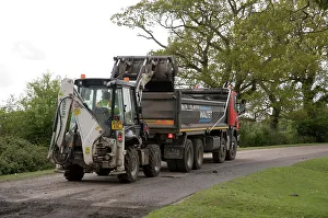 Repairs Prints: Road resurfacing work repairing potholes