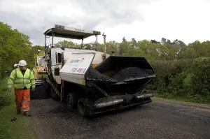 Repairs Prints: Road resurfacing work repairing potholes