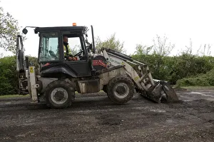 Repairs Prints: Road resurfacing work repairing potholes