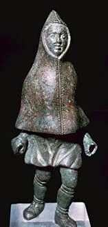 Gallo Roman Collection: Roman bronze figure of a man wearing a cloak, 4th century