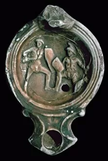 Roman clay lamp decorated with gladiators, 3rd century