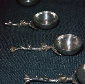 Roman silver and gilt ladles with handles cast in the form of dolphins, 4th century