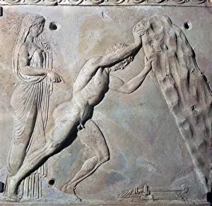 Roman terracotta Campana plaque showing Theseus lifting a huge rock Roman terracotta Campana plaque showing Theseus lifting a huge rock