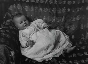 Laying Prints: Rosen, Walter T. Mrs. baby of, portrait photograph, 1915. Creator: Arnold Genthe