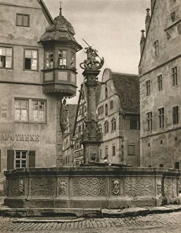 Mittelfranken Prints: Rothenburg o. d. T. - St. Georges Fountain - Marien-Apotheke, 1931. Artist: Kurt Hielscher