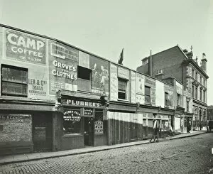 Derelict Gallery: Row of shops with advertising hoardings, Balls Pond Road, Hackney, London, September 1913