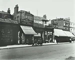 Advertising Hoarding Gallery: Row of shops including the West London Workshops for the Blind, London, 1913