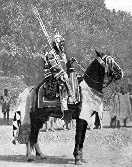 Peoples Of The World In Pictures Gallery: Royal bodyguard in ancient armour, northern Nigeria, 1936.Artist: Wide World Photos