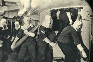 Aircraft Carrier Gallery: Royal Marines handling ammunition on board HMS Illustrious, World War II, c1939-c1943 (1944)