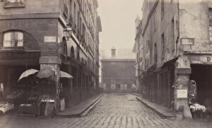 Cobblestone Gallery: Rue du Contrat-Social, de la rue de la Tonnellerie, 1864-1865. Creator: Charles Marville