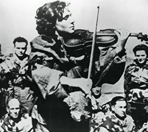 Russian army nurse playing a violin, Eastern Front, 1944