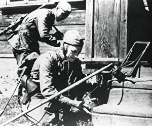 Russian soldiers with mine detectors clearing a booby-trapped house, Eastern Front, 1944
