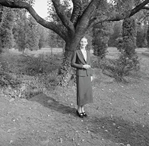 Portrait Photographs Prints: Ruth, standing outdoors by a tree, 1936 Creator: Arnold Genthe