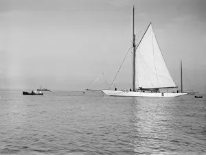 Towing Prints: Sailing yacht Bona being towed, 1912. Creator: Kirk & Sons of Cowes