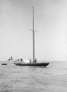 Johan Prints: The sailing yacht Rollo at anchor, 1911. Creator: Kirk & Sons of Cowes