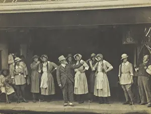 Cast Prints: Sailors, some in drag, stand on stage performing a scene