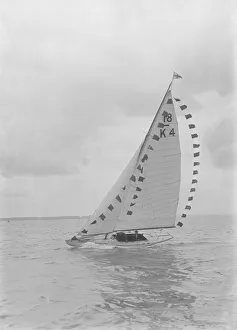Saling yacht Asphodel (K5) with prize flags, 1922. Creator: Kirk & Sons of Cowes