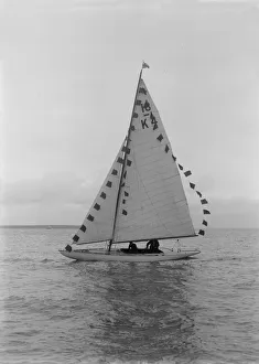 Saling yacht Asphodel (K5) with prize flags, 1922. Creator: Kirk & Sons of Cowes