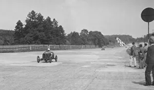 Finishing Prints: Two Salmson cars taking the chequered flag at Brooklands. Artist: Bill Brunell