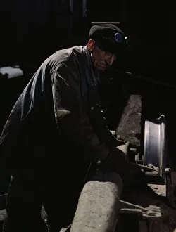 Railroad Shop Prints: Sam Cell, working on the truck of a car