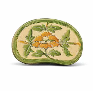 Glazed Pottery Prints: A sancai carved peony pillow, Between 960 and 1127