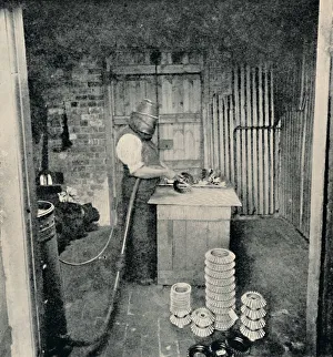 Archibald Williams Gallery: Sand-blasting Gear Wheels, c1917