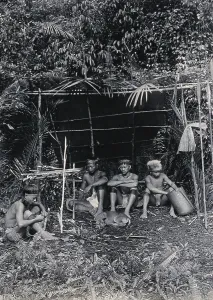 Adolescent Prints: Sarawak: four Kayan hunters in their camp, c1900. Creator: Unknown