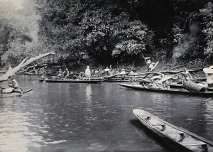 Canoe Prints: Sarawak: a Malaysian tribe fishing on the Baram River, c1900. Creator: Unknown