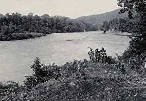 South East Asia Prints: Sarawak: three men standing by the Baram River, c1900. Creator: Unknown