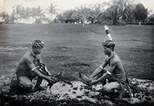 South East Asia Prints: Sarawak: two Sea Dayaks at a cockfight, c1900. Creator: Unknown