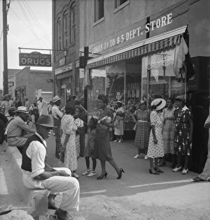 Saturday afternoon - shopping and visiting on main street of Pittsboro, North Carolina, 1939. Creator: Dorothea Lange