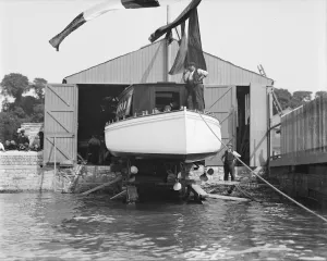 Slipway Prints: Saunders motor launch on slipway ready for launching, 1908. Creator: Kirk & Sons of Cowes